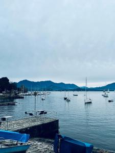 a group of boats are docked in the water at Casa Gio in Lesa