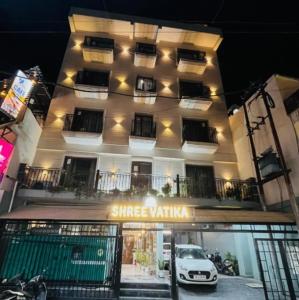 a white car parked in front of a building at Shree Vatika in Rishīkesh +11 photos