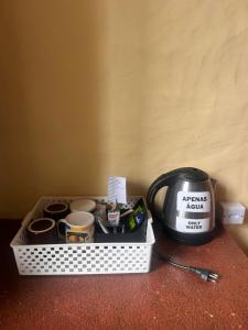 a tray of food sitting on a counter next to a toaster at Pousada e Hostel Pé no Mato in Vale do Capao