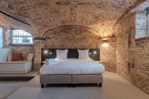 Llit o llits en una habitació de Hotel Lucca