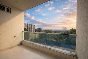 a balcony with a view of a city at Hotel Blueberry Bhedaghat in Jabalpur