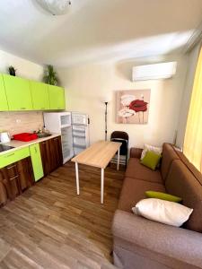 a living room with a couch and a table at Cascadas, Studio apartment with a pool view in Sunny Beach +31 photos