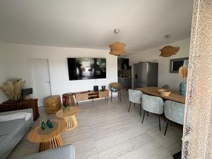 a living room with a couch and a table at Villa TerraAurora in Barbat na Rabu