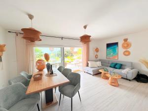a living room with a couch and a table at Villa TerraAurora in Barbat na Rabu