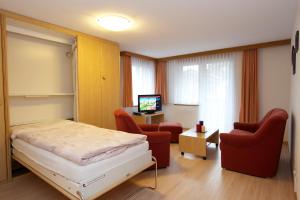 TV a/nebo společenská místnost v ubytování Bolero Appartements