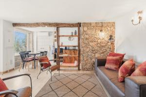 a living room with a couch and a table at Banduja Reserve - Slow by nature in Celorico de Basto