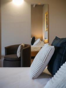 a white shoe sitting on the floor in a living room at Moscatello & Mulinër Design Agri Relais in Pozzolengo