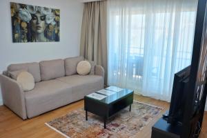 a living room with a couch and a table at Giorgio Luxury Suites in Belgrade