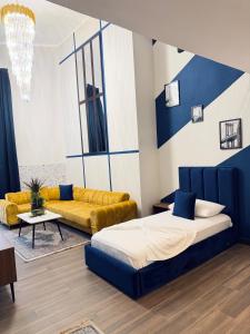 a living room with two beds and a couch at Andor Luxury Hotel & Duplex in Durrës +245 photos