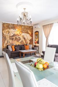 a living room with a table and a couch at Apartamenty Blisko Centrum in Toruń +44 photos