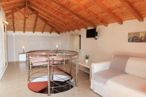a living room with a table and a couch at Lina`s Apartment & Maisonette in Neo Klima