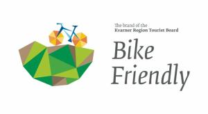a logo for the island of the kenmare region trout band at Soba Erika in Fužine