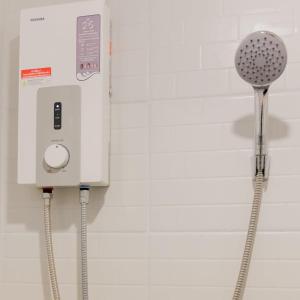 a soap dispenser is hanging on a wall at Allrange Home 5 bedroom for 10 guests in Chiang Mai +43 photos