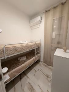 a bathroom with a metal bunk bed in a room at B&B Heracleae Luxury Home in Cattolica Eraclea +25 photos
