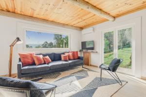 a living room with a couch and a window at Banduja Reserve - Slow by nature in Celorico de Basto