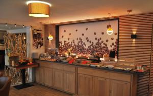 a buffet line in a restaurant with food on display at Hotel Montana in De Panne +23 photos
