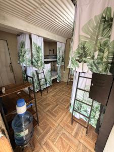 a room with a tent with chairs and a table at Karma Muse Hotel in La Libertad +15 photos