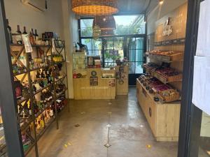 a store aisle with a lot of bottles of alcohol at Posada Las Chacras in Ciudad Lujan de Cuyo