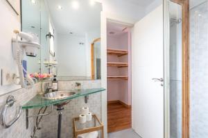 a bathroom with a sink and a shower at Casa de la Catedral in Granada +247 photos
