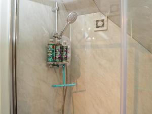 a shower with a shower head next to a shower at The Hideaway Loft in Chippenham +13 photos