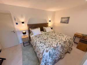 a bedroom with a large bed and two lamps at Seaview Residence Krk 2 Bedrooms 2 Bathrooms Free Parking in Krk +10 photos