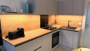 a kitchen with a counter top with a laptop on it at Seaview Residence Krk 2 Bedrooms 2 Bathrooms Free Parking in Krk