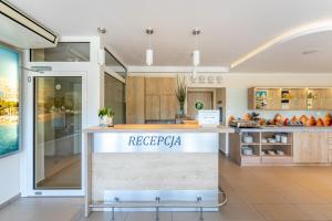a kitchen with a counter in a room at Villa Cannes Jastarnia in Jastarnia