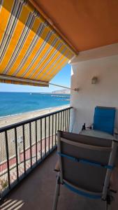 a balcony with a view of the ocean at Primera Linea de playa in Almería
