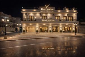 a lit up building with aoked victoria sign on it at The Vedam Hotels - Ram Mandir Ayodhya A unit of RL Group of Hotels Ayodhya in Ayodhya