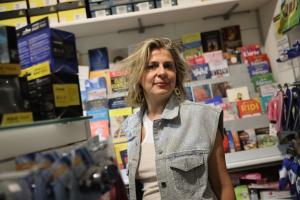 a woman is standing in a store at Antonia's Home - casa per le vacanze con giardino e veranda attrezzati in San Domino