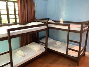 a group of bunk beds in a room at Libhu Hill Resort and Sports Complex in Maasin