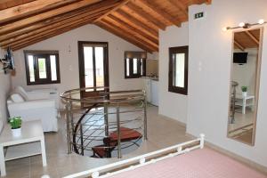a living room with a glass table and a kitchen at Lina`s Apartment & Maisonette in Neo Klima +37 photos