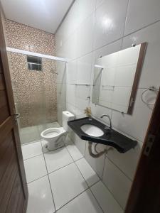 a bathroom with a sink and a toilet at Casa Timon in Timon +4 photos