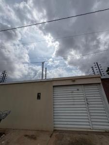 a garage with a white garage door on a building at Casa Timon in Timon