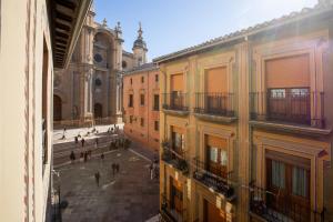 a view of a city street from a building at Casa de la Catedral in Granada