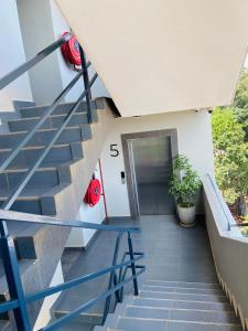 a staircase leading up to a building with a door at Haven stay in Kiambu