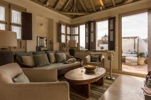 a living room with a couch and a table at Balcón de Córdoba in Córdoba