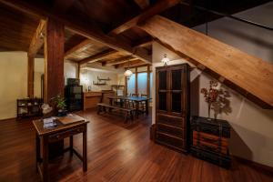 a living room with a table and a dining room at NEKO no TSUKI in Takayama