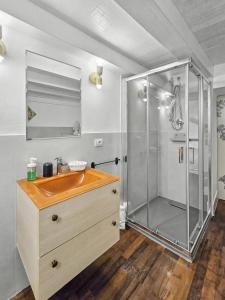 a bathroom with a shower and a wooden sink at La Via della Giudecca in Syracuse +166 photos