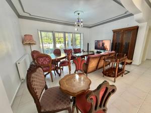 a dining room with a table and chairs at Dalyan Grand Garden in Ortaca