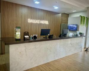 a lobby of a dallas hotel with a reception desk at Dallas Hotel in Palotina