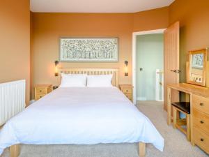 a bedroom with a white bed and a window at 3 Bed in Bideford oc-78796 in Northam