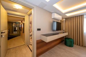 a bathroom with a sink and a mirror at Karaköy Prive Suites in Istanbul +28 photos