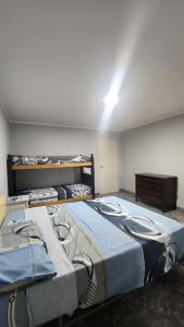 a room with two beds in a room at Norte Hogar in Salta