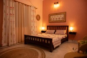 a bedroom with a bed with two pillows at Inayat-Pet friendly boutique homestay in Dehradun