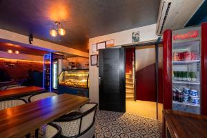a restaurant with a table and a refrigerator at Karaköy Prive Suites in Istanbul