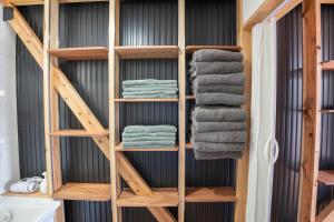 a towel rack in a bathroom with towels at 皓雲庵plus in Miyakonojō +18 photos