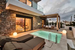 a house with a swimming pool in the backyard at POLYTELIA - Luxury Living in Elaía