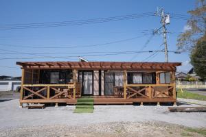 a small house with a brown roof at 皓雲庵plus in Miyakonojō