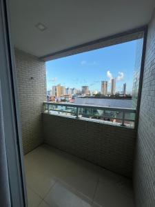 a balcony with a view of a city skyline at 2 quartos a 300m do mar do bessa in João Pessoa